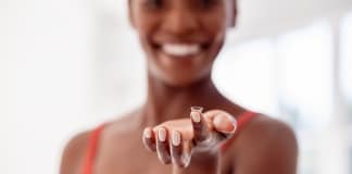 woman-holding-contact-lens