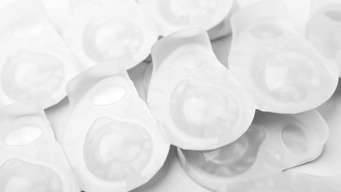 several-packs-of-contact-lens-on-white-surface