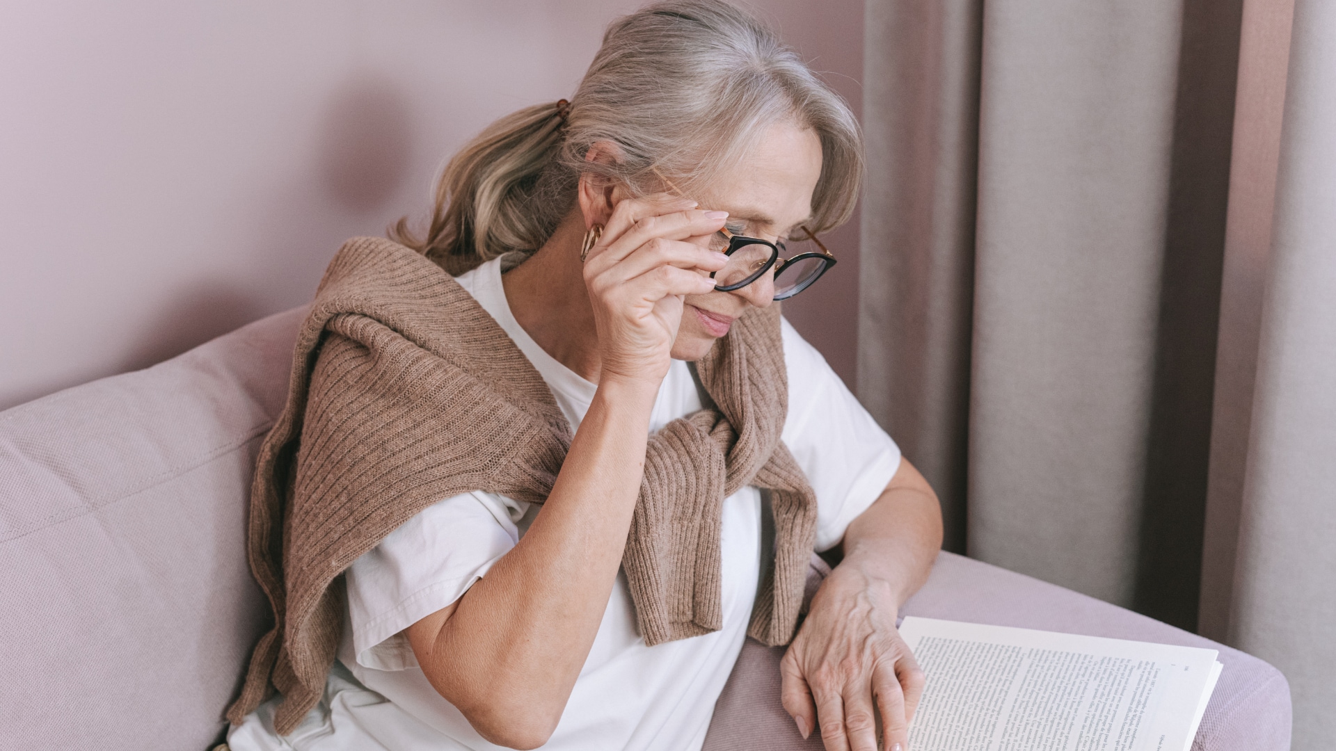 elderly-woman-with-gray-hair-reading-a-book
