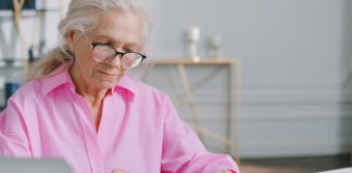 elderly-woman-looking-at-documents