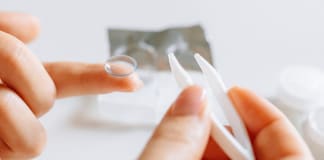 close-up-of-putting-of-contact-lens-on-finger