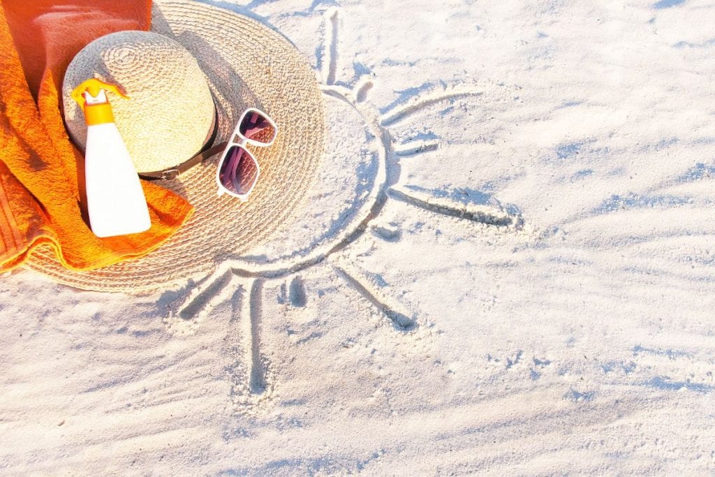 hat-and-sunglasses-on-the-beach