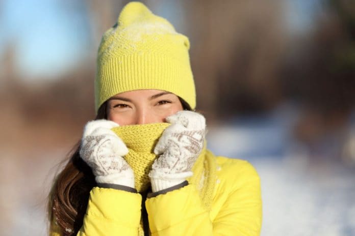 winter-freezing-woman-covering-face-from-cold