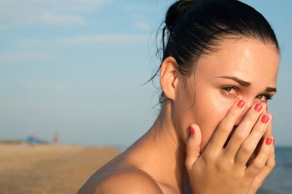 young-woman-with-red-eye-rubbing-irritated-sensitive-eyes